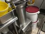 many buckets and a mixer in a kitchen