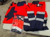 a red and blue jacket and pants on a table
