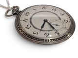 a silver pocket watch with a chain on a white background