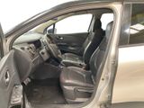 the interior of a car with the door open and the driver ' s seat down