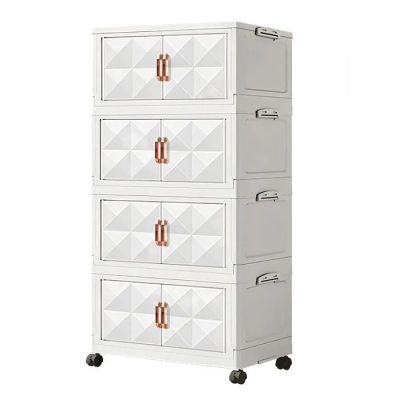une photo d'une commode blanche sur roulettes