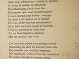 a picture of a poem written in french on a book