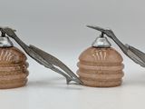 two salt and pepper shakers sitting on a table
