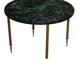 une image représentant une table avec un plateau en marbre vert et des pieds en laiton