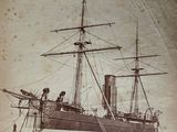 an old photo of a ship in a body of water