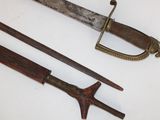 two old swords that are on a white surface