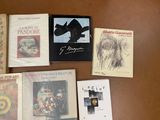 many books that are sitting on a table
