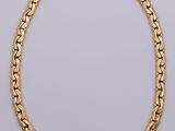 a gold chain necklace with a link