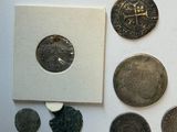 a lot of coins that are sitting on a table