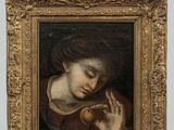 une image représentant un tableau où l'on voit une femme tenant une pomme