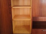 an image of a cabinet with shelves and drawers