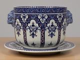 a blue and white bowl and saucer on a table
