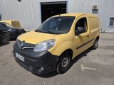 yellow and black van parked in front of a building in a parking lot