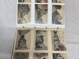 an open black and white photo of a suitcase with pictures inside of it