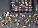 a lot of pins on the table next to a baseball bat