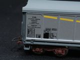 a close up of a toy train car on a black surface