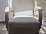 a chair that is sitting in front of a window