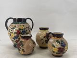 three vases sitting next to each other on a table