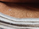 a stack of cloth that is sitting on top of a table