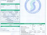 an image of a green and white document with a barcode on it