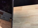 a laptop that is sitting on a wooden table