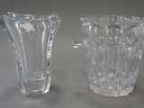 two glass vases sitting next to each other on a table
