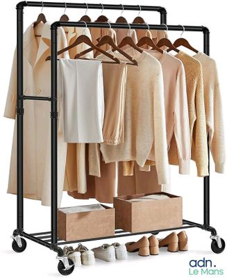an image of a clothes rack with clothes hanging on it