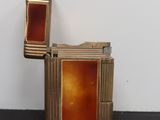 an image of a lighter sitting on top of a table