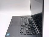 a laptop computer sitting on a table with a white background