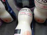 bottles of toothpaste, toothbrushes, and toothpaste on a counter