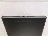 a close up of the back of a laptop computer on a white surface