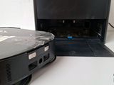 a laptop that is sitting on a table next to a dvd player