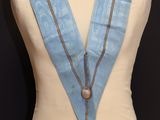 an image of a mannequin with a blue scarf on it