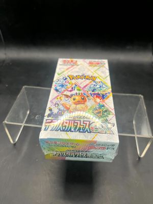 a box of pokemon cards sitting on a table