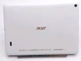 the back of a white acer laptop sitting on top of a table