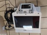 a computer monitor sitting on top of a white box