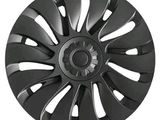 a close up of a black wheel cover on a white background