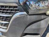 a close up of a car ' s front grill and headlight