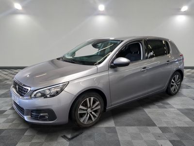 a picture of a silver car parked in a garage