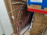 a pile of boxes sitting on the floor next to a toilet