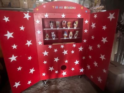 a red and white display case with white stars on it
