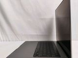 an open laptop computer sitting on top of a white surface