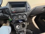 a person sitting in the driver ' s seat of a car