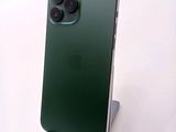 a green iphone that is sitting on top of a stand