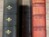 two books sitting on a shelf next to each other