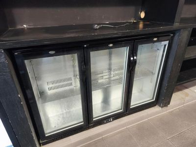 two glass doors that are open in a kitchen