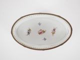 a white plate with a floral design on it