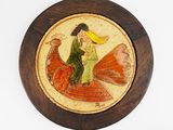 a wooden plate with a picture of a woman riding a bird