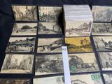 many old postcards that are on a table