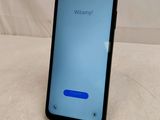 a close up of a cell phone on a table with a white background